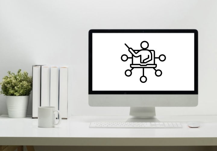 Computer on a desk with an icon depicting training